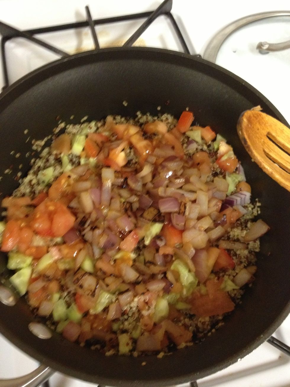 Stir in saut\u00e9ed onions, tomatoes, cucumbers and add salt to taste. Stir in olive oil