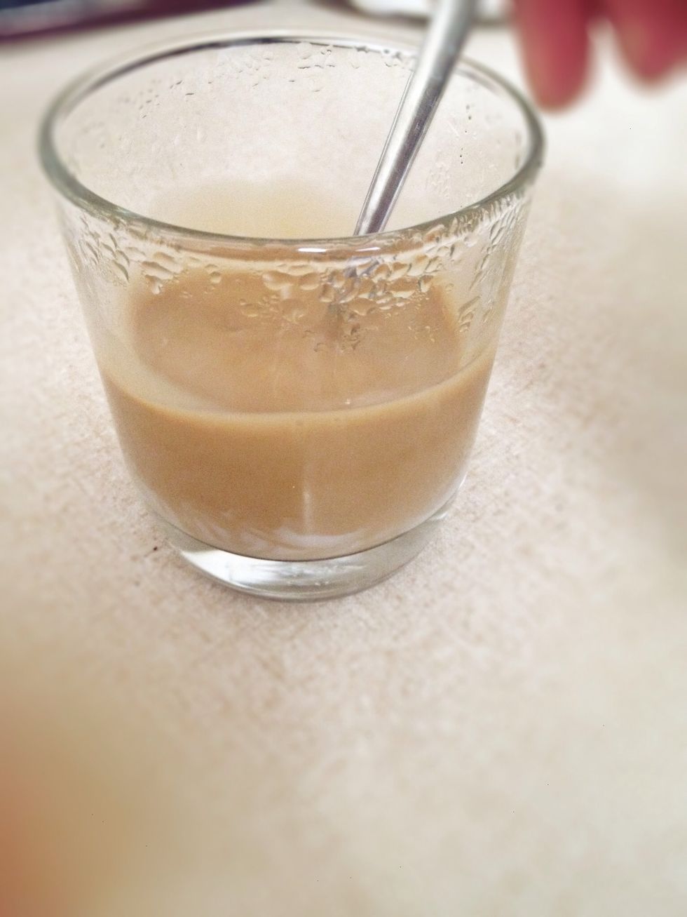 Stir in the condensed milk after the coffee has finished dripping