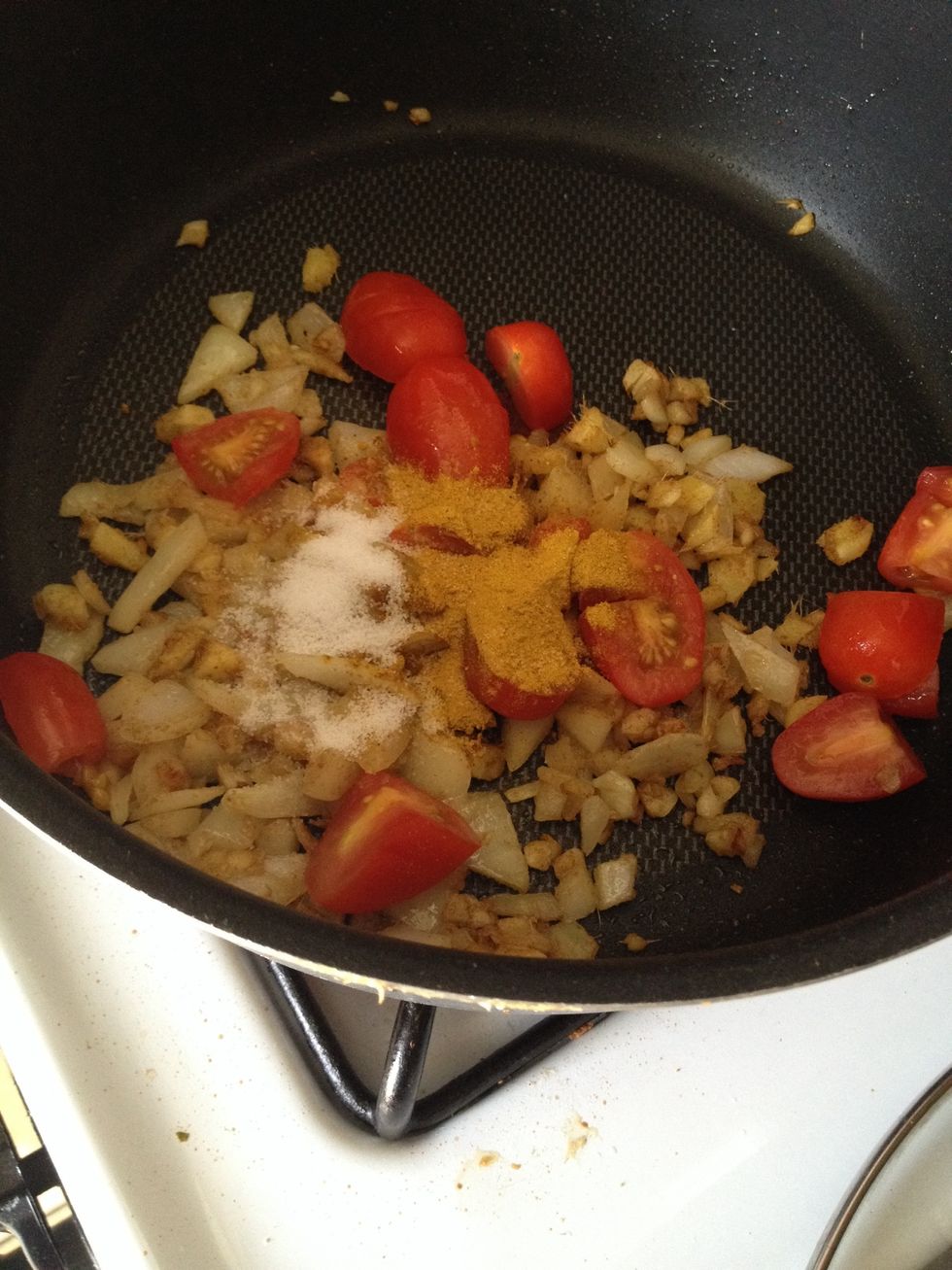 Stir in the diced tomato, cayenne pepper, salt, turmeric, and coriander.