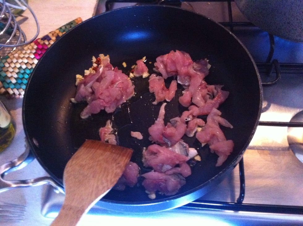 Stir in the fish meat and let cook until it turns white and firm.