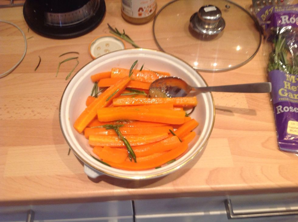 Stir in the honey and rosemary and toss so all carrots are covered. Then roast at 225 for 45 minutes until the carrots are sticky with a slight bite