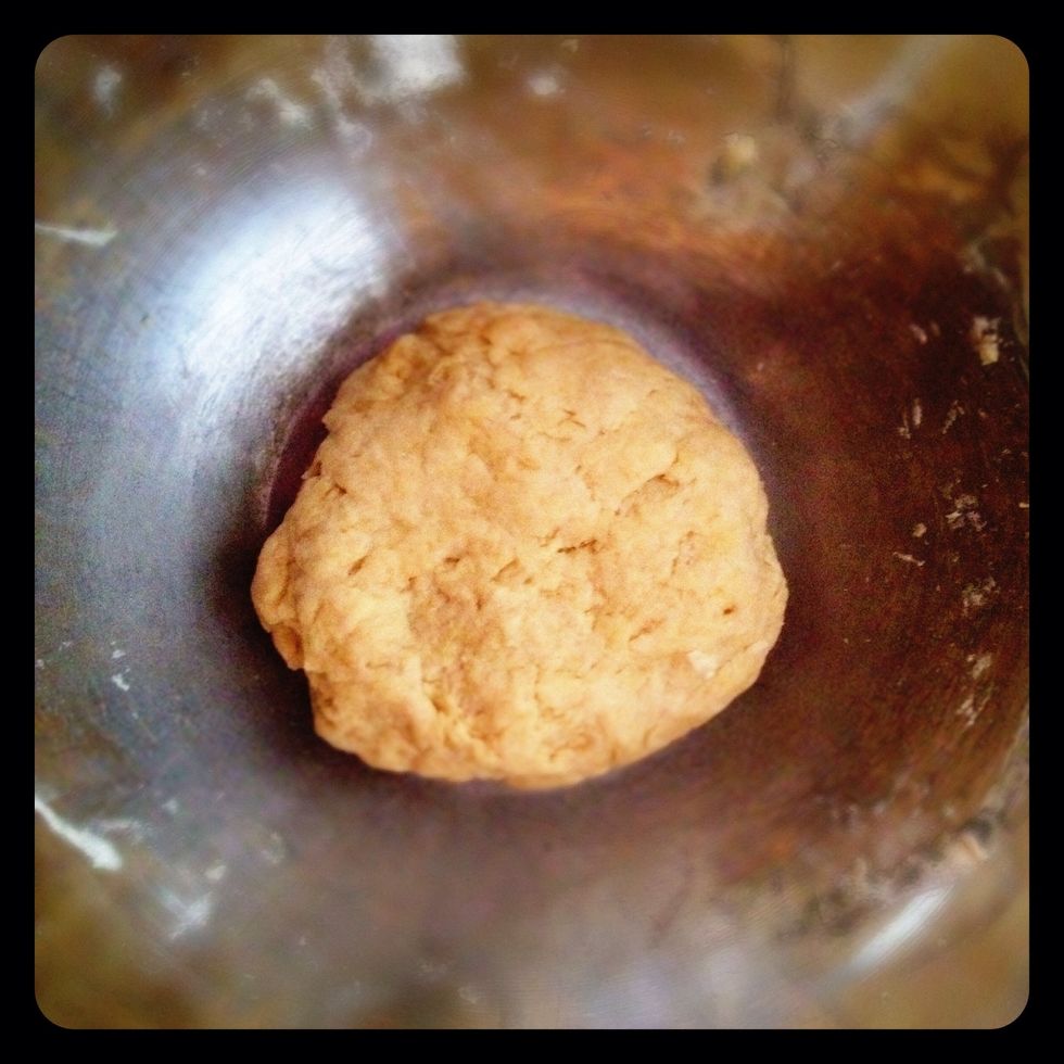 Stir in the oil, then with your hands, kneed in the water until it forms a ball.   I only used about 3/4 cup water.