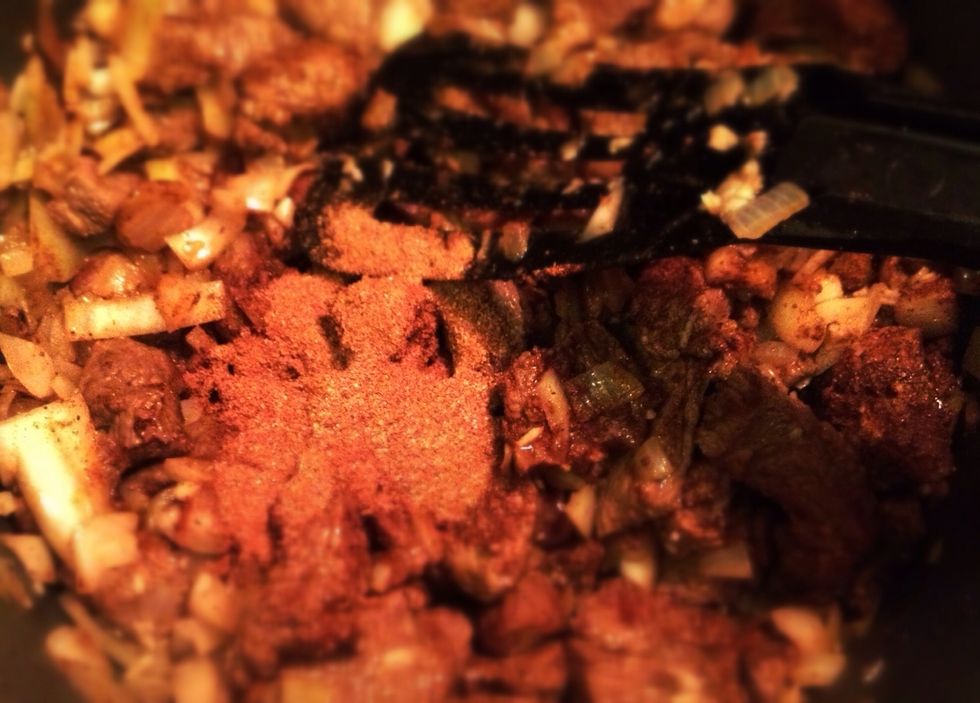 Stir in the spice mix. Add water and broth.