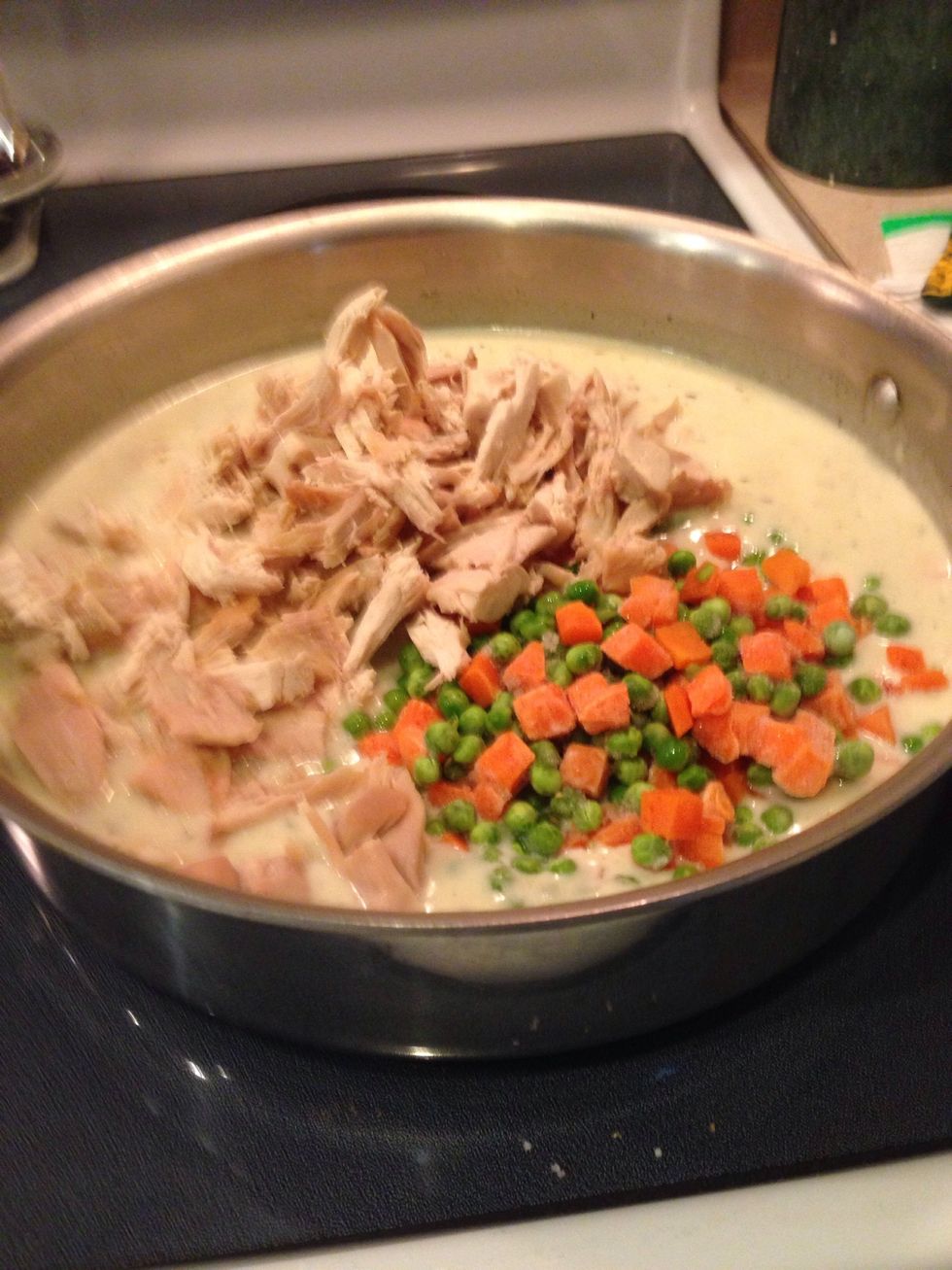 Stir in vegetables, chicken, and lemon juice and simmer till heated through, 2-3 minutes.