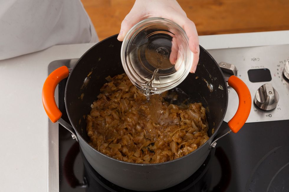 Stir in wine and deglaze your pan, making sure to scrape off any browned pieces on the bottom of the pan.