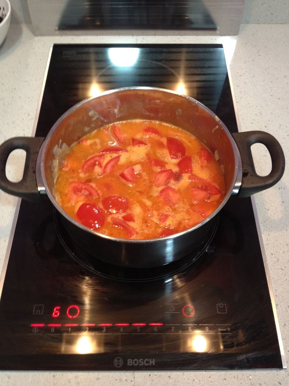 Stir it all and after 5' put water until tomatoes are just covered