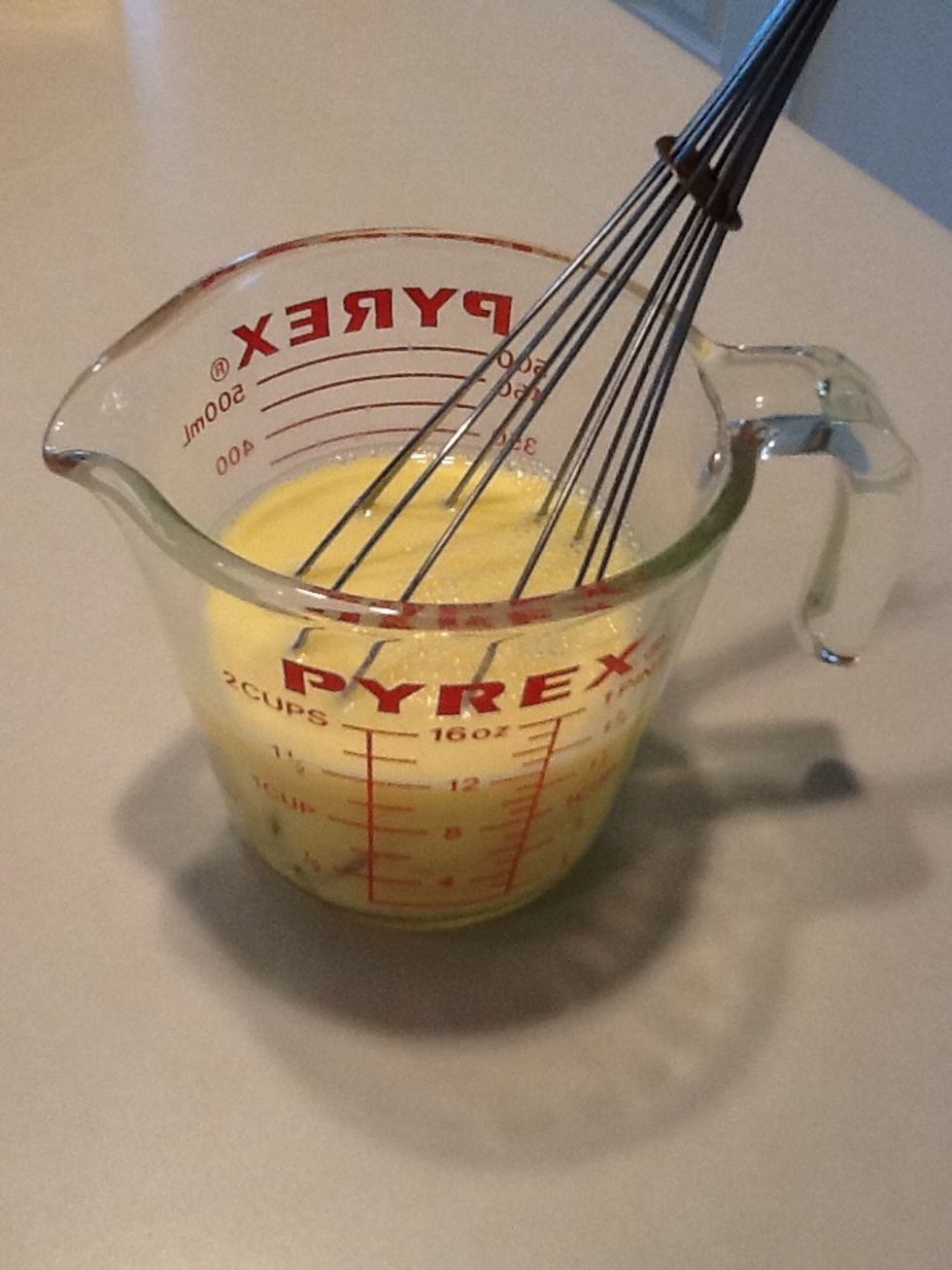 Stir milk and eggs with a whisk to blend well.