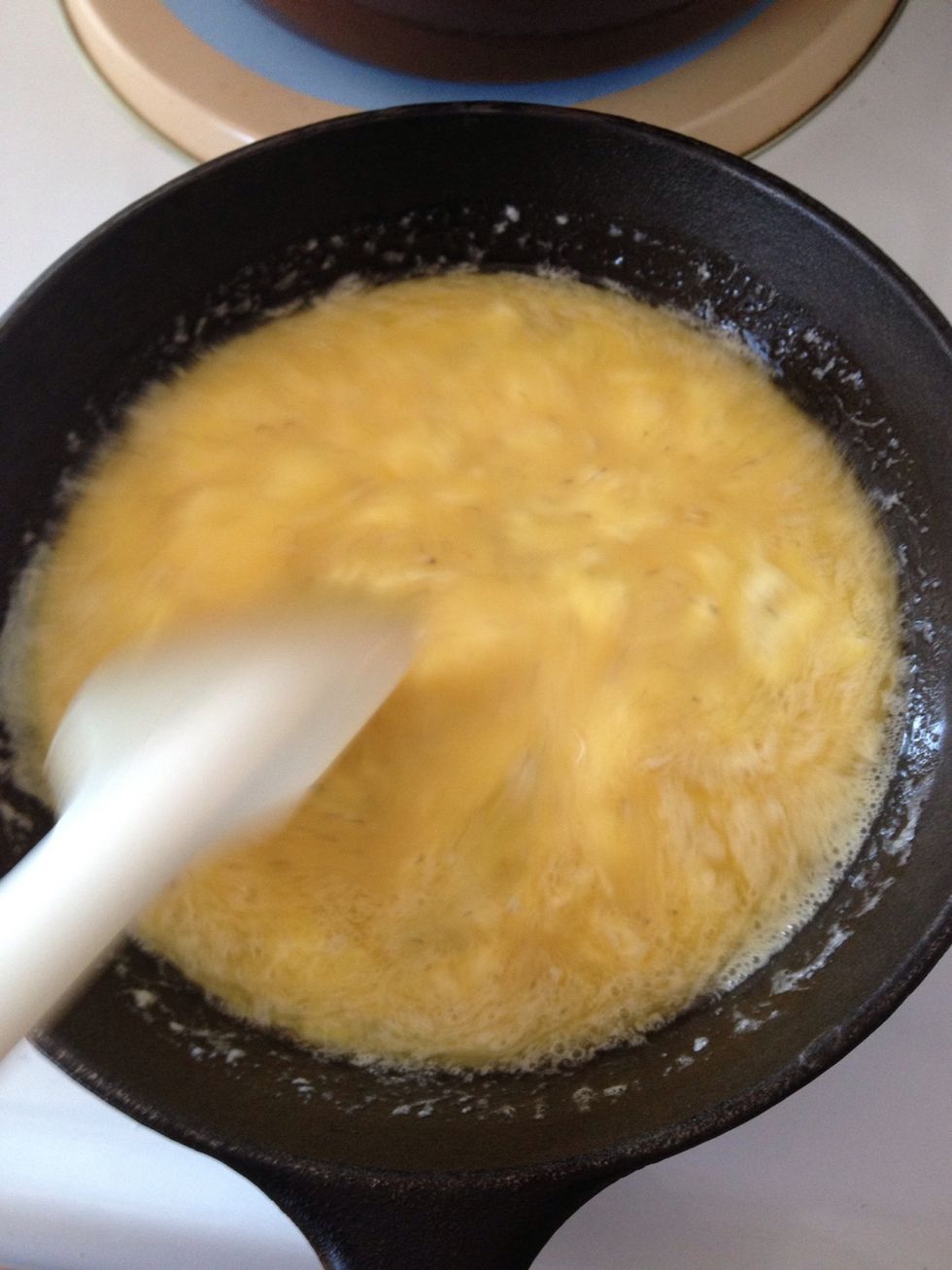 Stir more! Eggs will eventually start cooking, be patient.