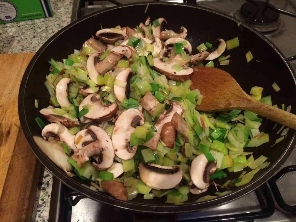 Stir mushrooms and leeks