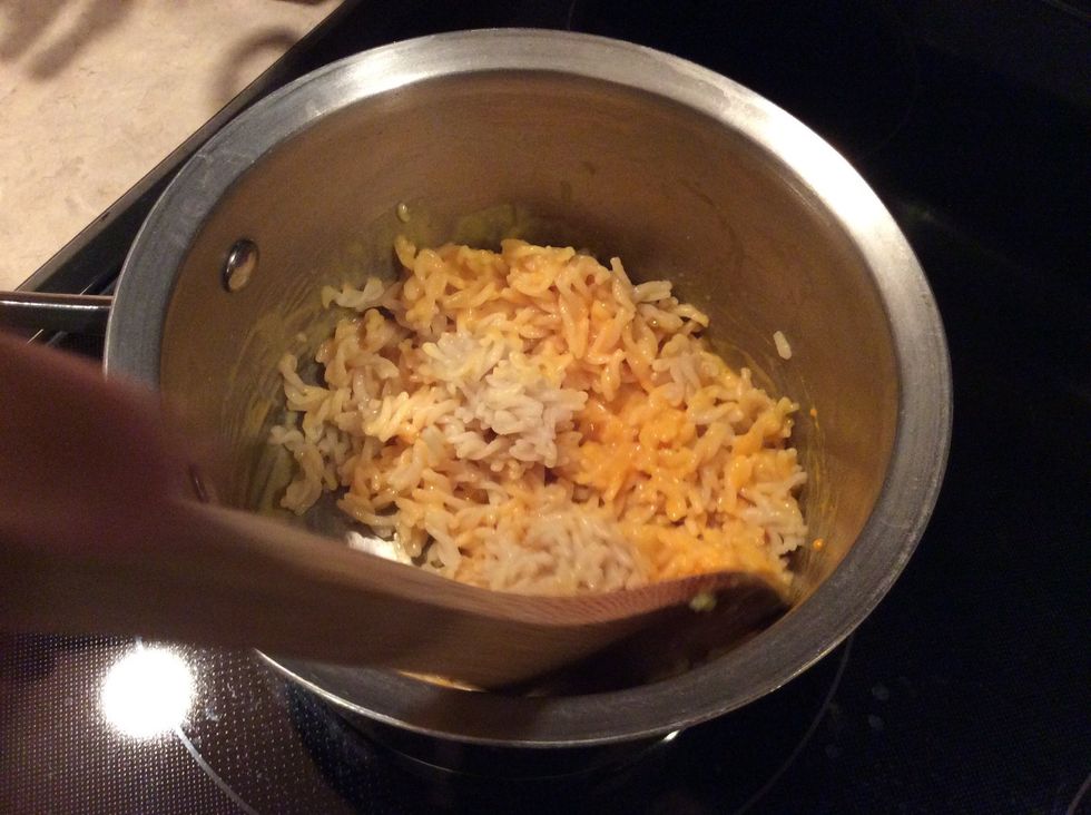 Stir noodles and cheese sauce together.