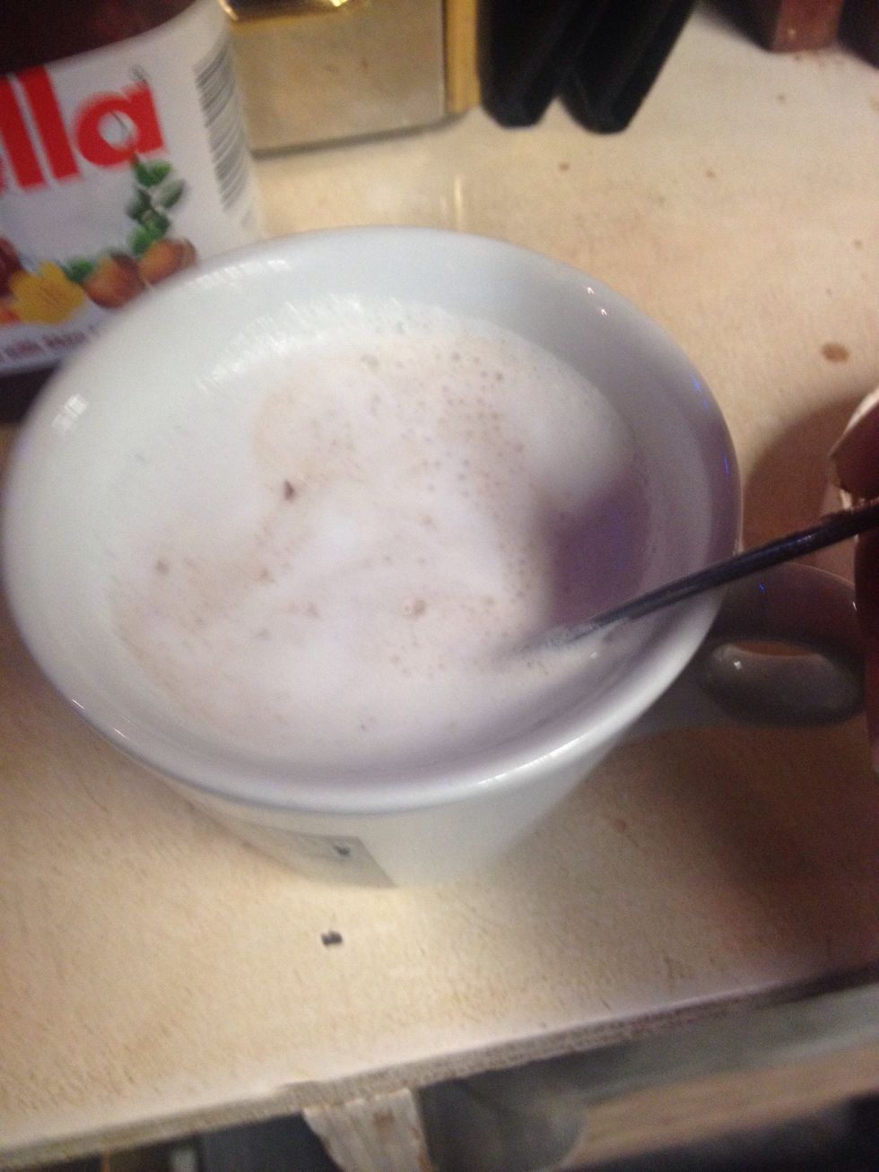 Stir Nutella into milk and press the Nutella at the bottom into itself. This prevents clumps that would just float at the top.