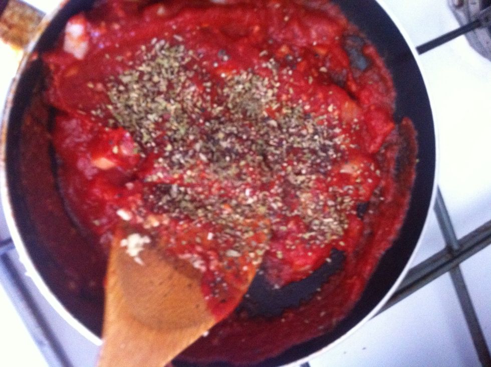 Stir on low flame and add black pepper, basil, and oregano. (Again, fresh if possible).