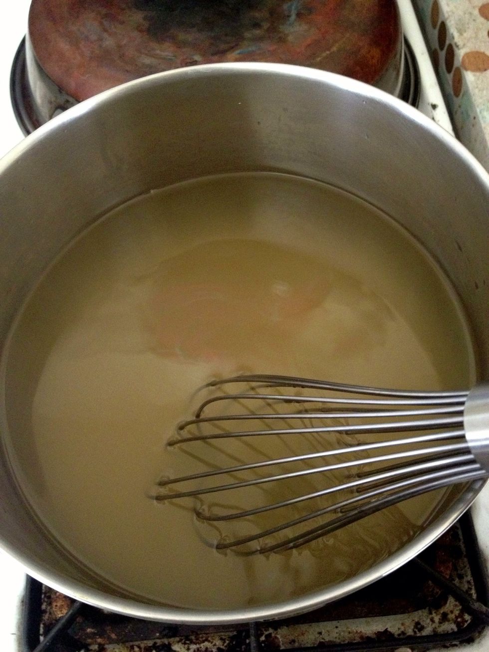Stir over low heat until the sugar is completely dissolved.