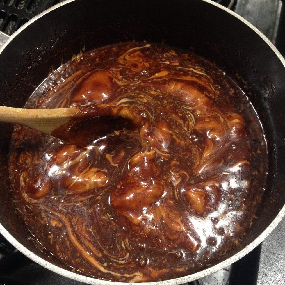 Stir peanut butter into the mixture for about a minute. The peanut butter should be melted through out the mixture when done.