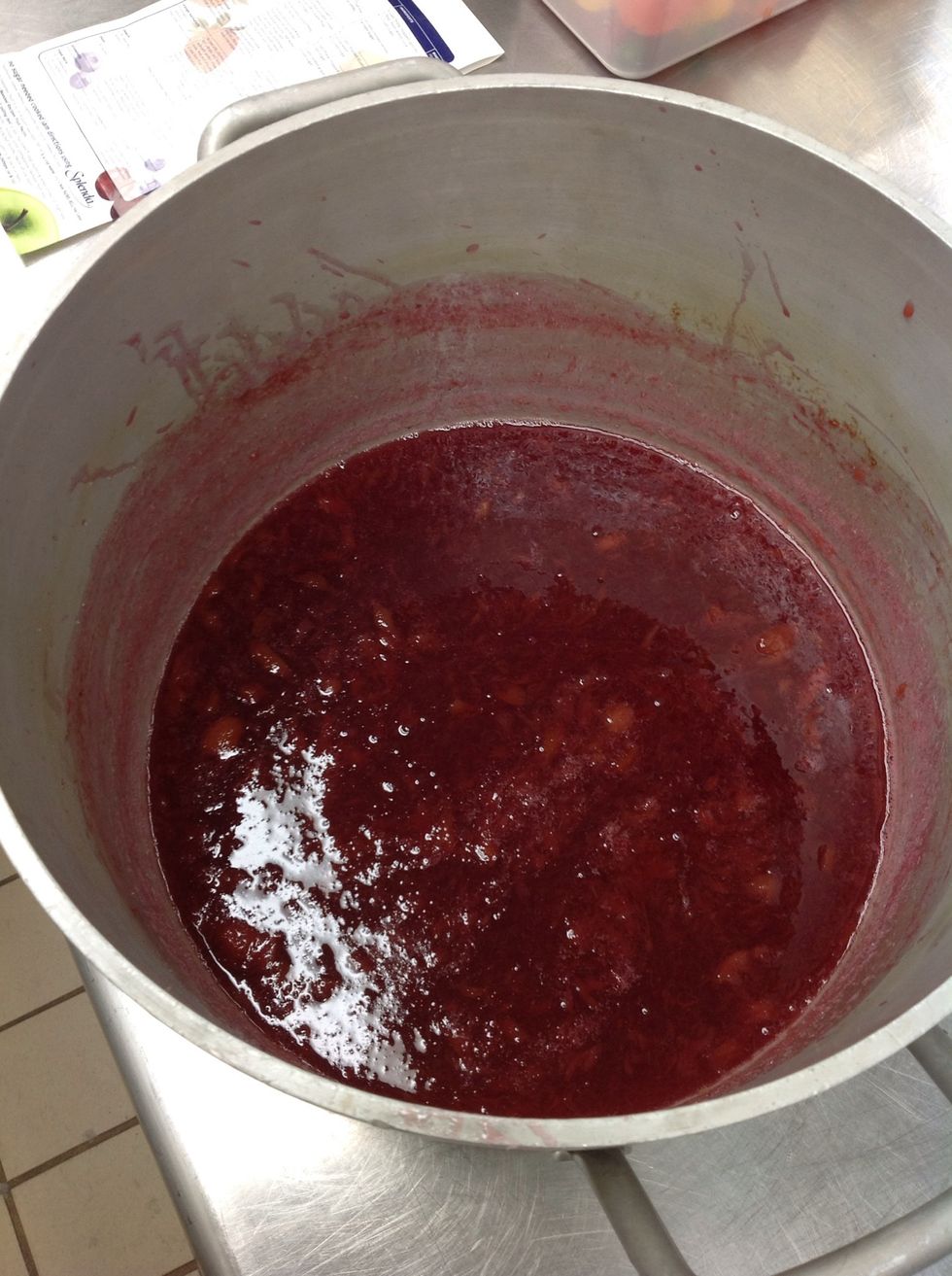 Stir pectin sugar mixture into fruit.