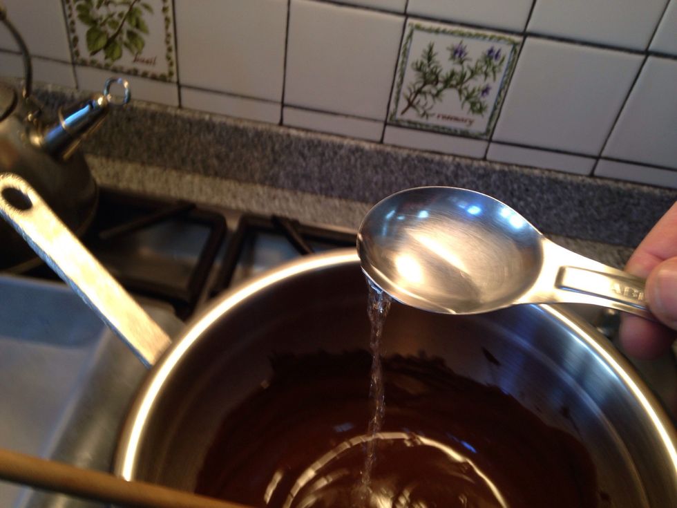 Stir peppermint extract into dark chocolate.