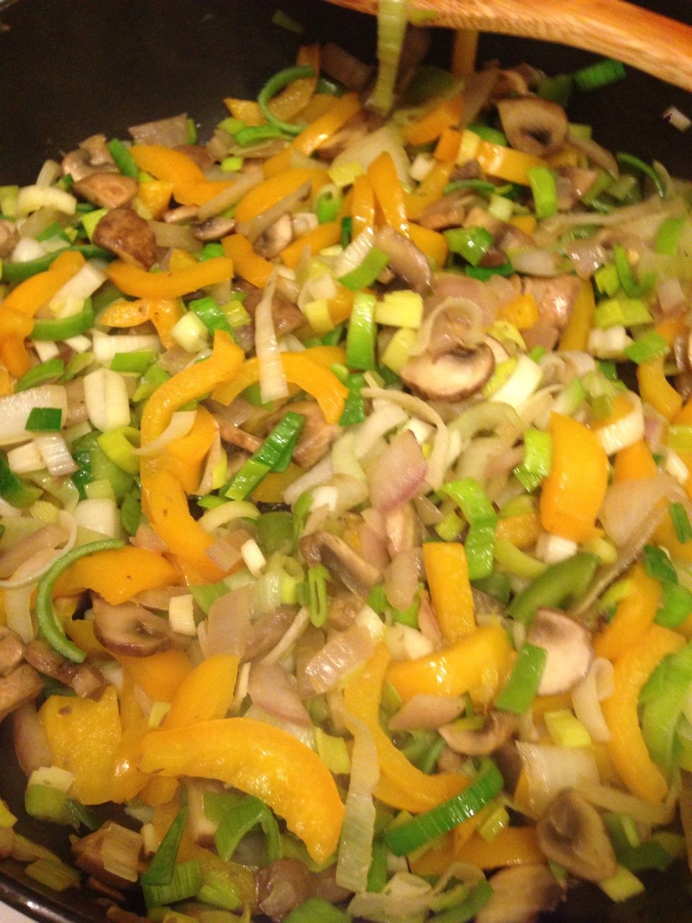 Stir saut\u00e9ed veggies for about 3 min. Leeks cook quickly.
