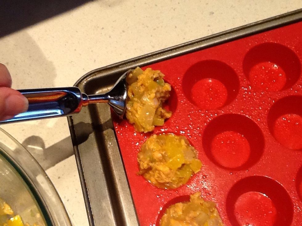 Stir, scoop from ice cream scoop into mini-muffin cups.