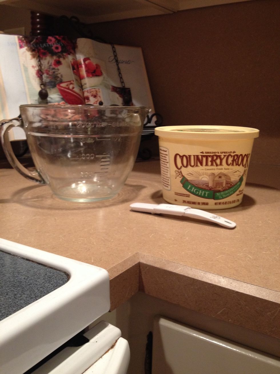 Stir softened butter and water in medium bowl.