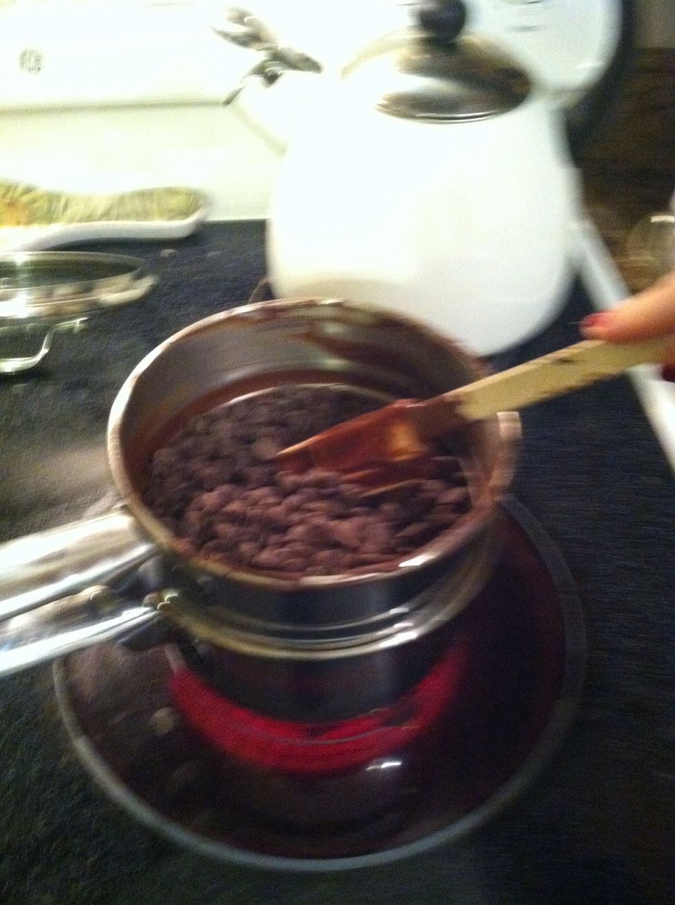 Stir, stir, stir so the chocolate doesn't burn. It's harder to burn with a double boiler but just to be safe. And also it melts faster when you stir.