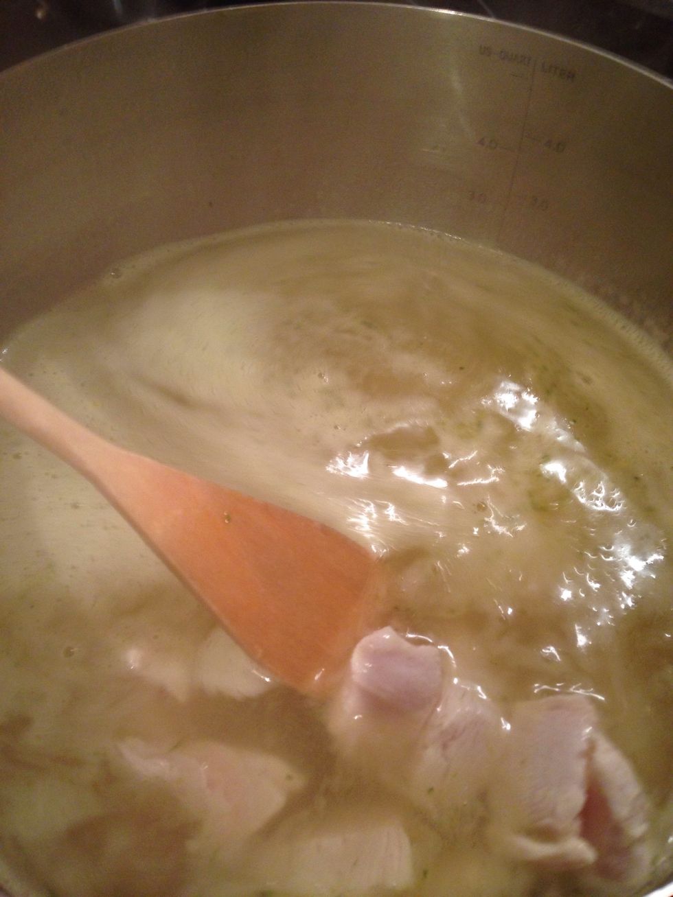 Stir the boiling water and put the chicken in. Leave it until the water boils again.