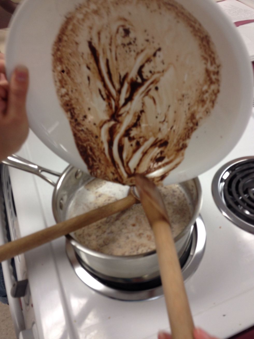 Stir the chocolate mixture into the simmering milk.