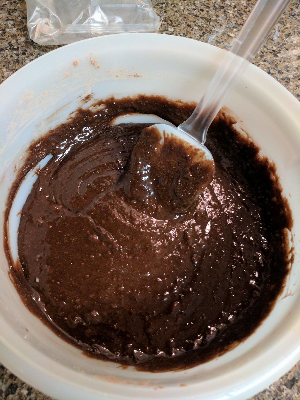 Stir the ingredients together using the spatula until the mixture is dark brown and evenly mixed.