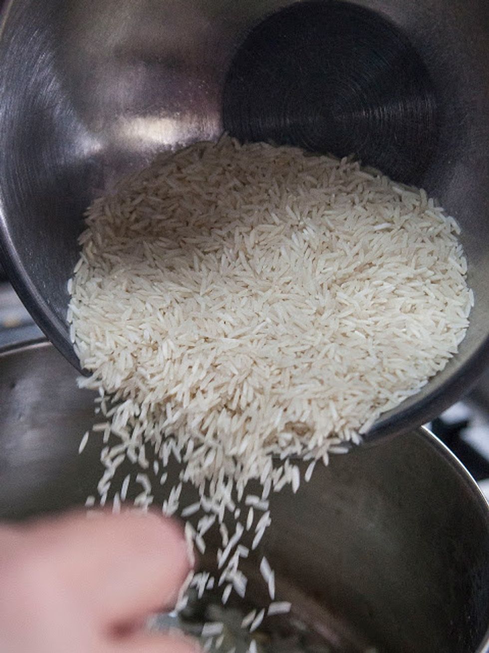Stir the onion around and saute it until it turns translucent, this takes about 5 minutes or so. Now add in the rice...