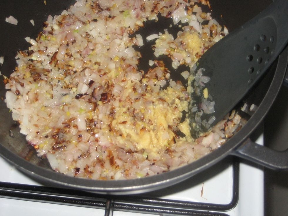 Stir the paste to mix completely with onion.