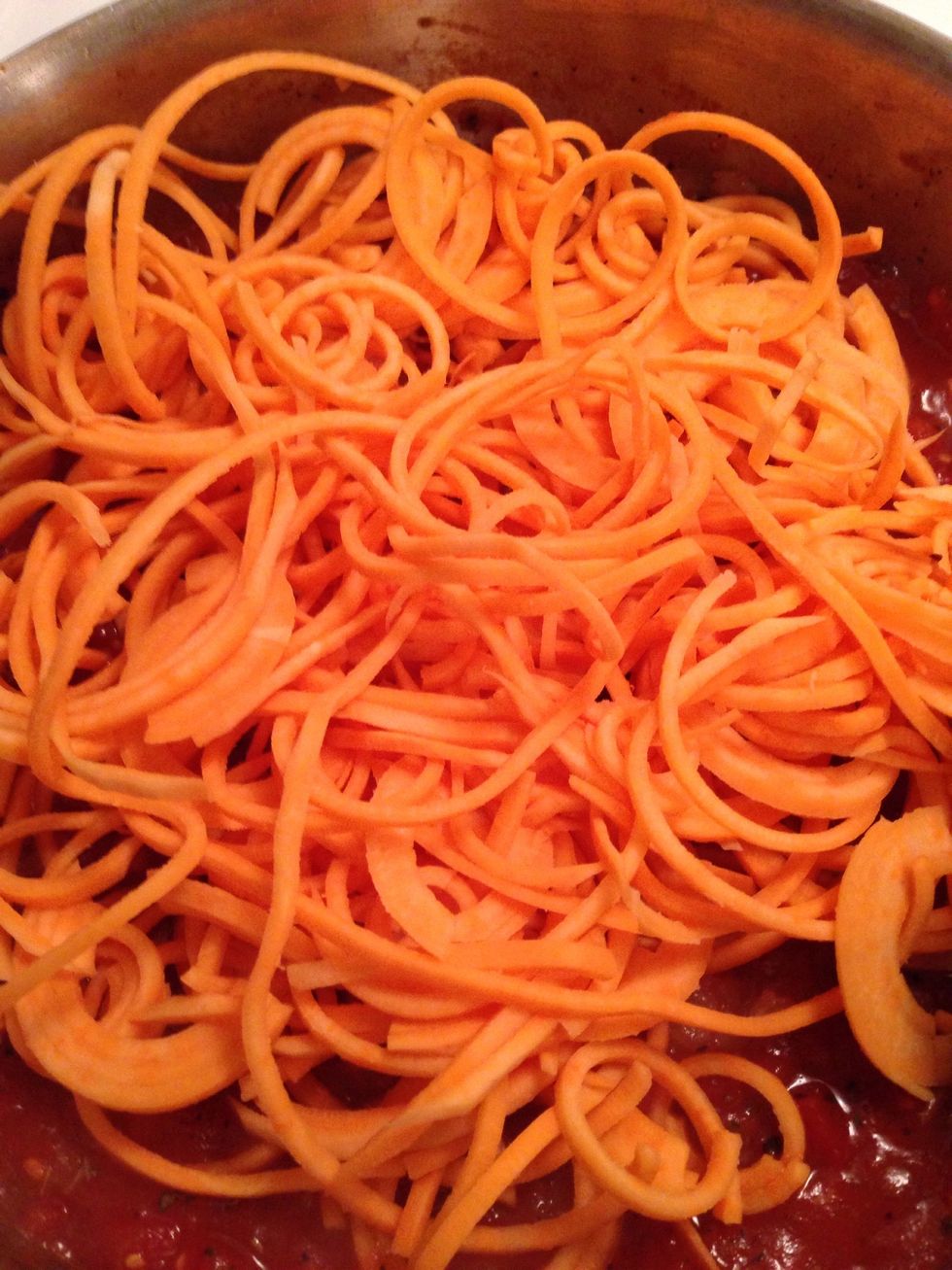 Stir the sauce and add in the sweet potato noodles.