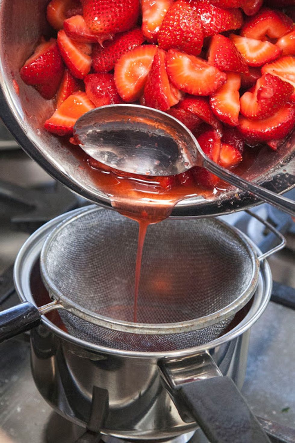 Stir the strawberries together in a bowl with the granulated sugar and let it sit for about 30 minutes, then strain the juice out of the berries. Place the juice in a small pot and set it aside.
