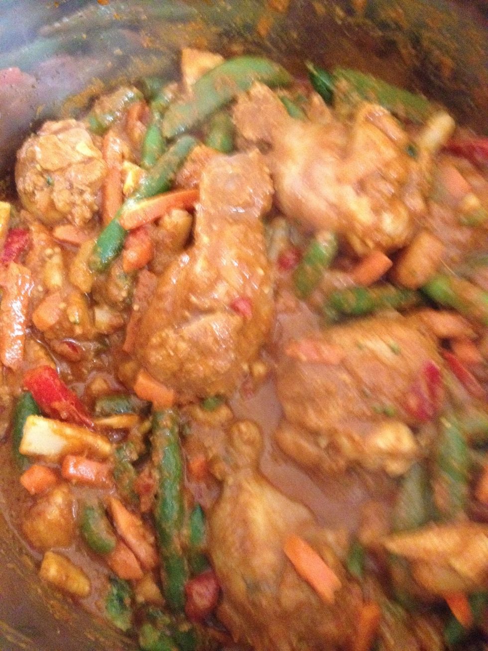 Stir the vegetables to ensure they are well coated with the curry sauce