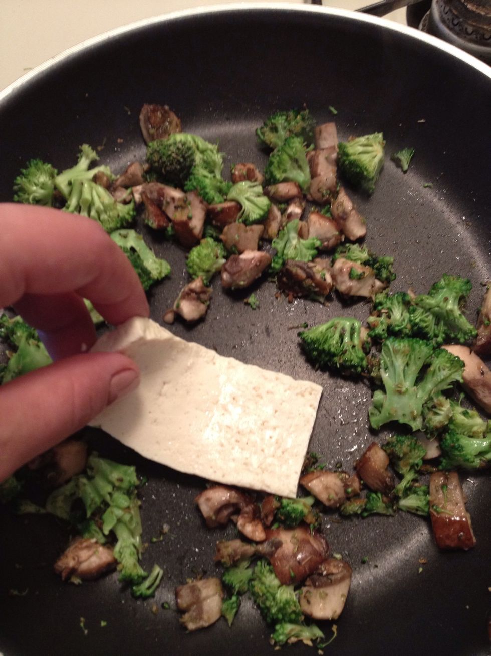 Stir the veggies for a few minutes them add the slices of tofu...