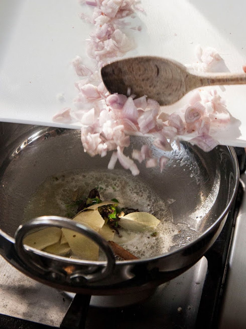 Stir them around  for about 1 minute then add in the shallots.