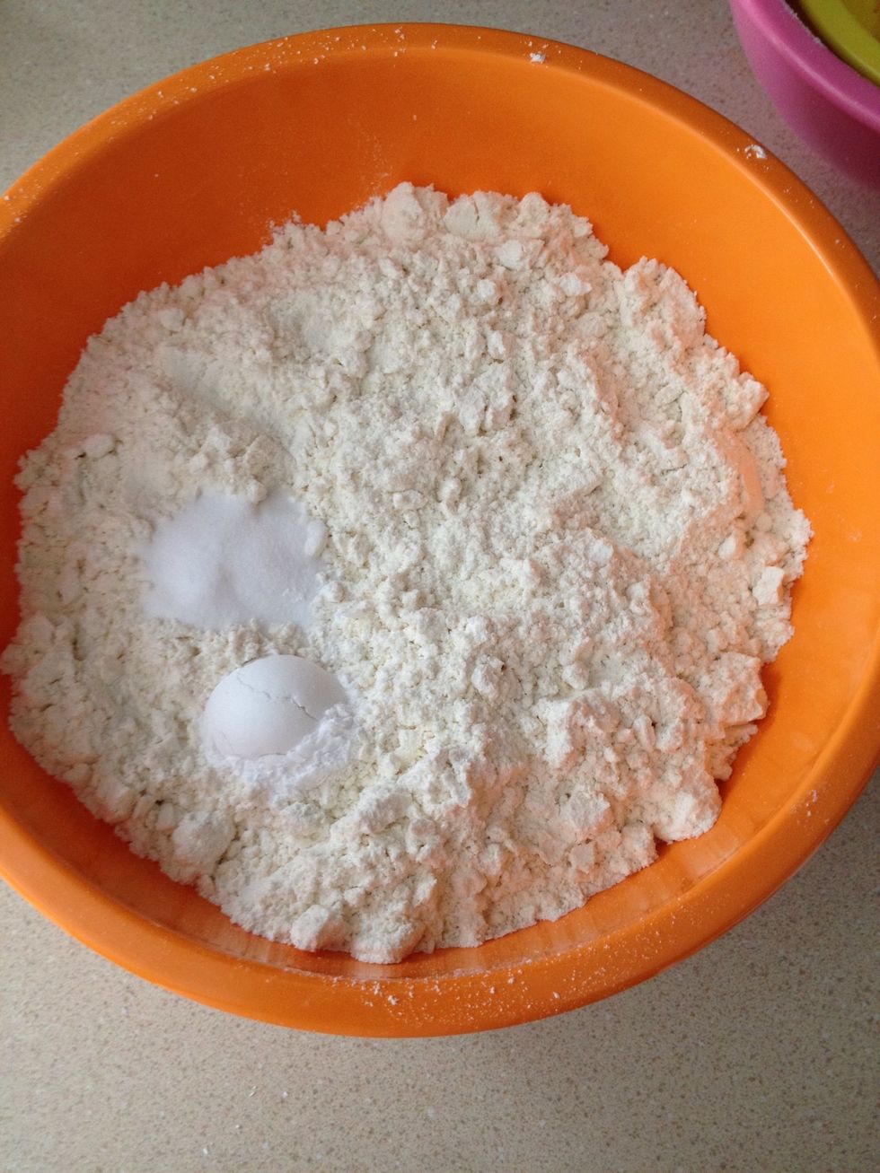 Stir together the flour with the baking soda and cream of tartar