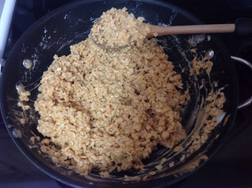 Stir until all Rice Krispies are coated in the peanut butter marshmallow mixture.