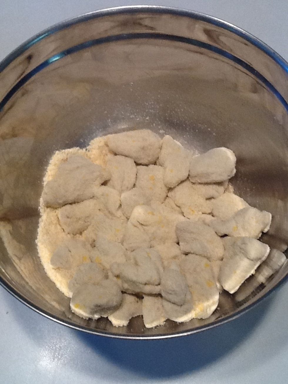 Stir until coated. You will have some Parmesan cheese left in the bottom of the bowl.