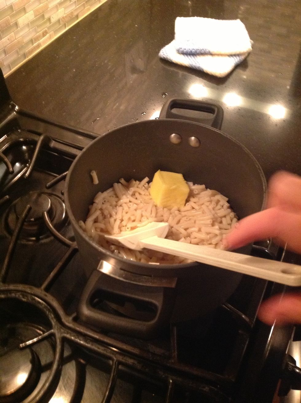 Stir until the butter melts with the noodles.
