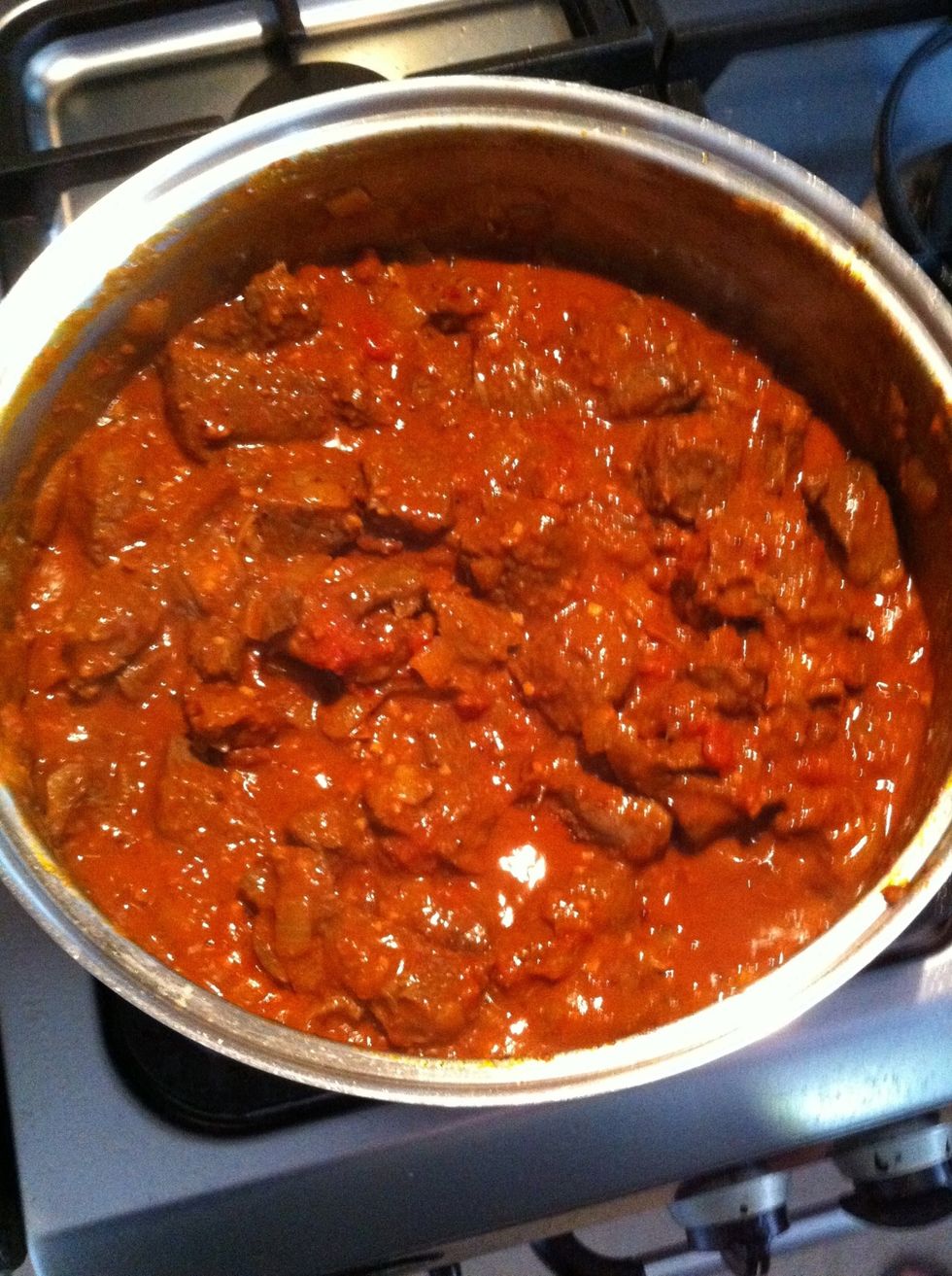 Stir well. Cover pan and simmer on a very low heat for about 2 hours.