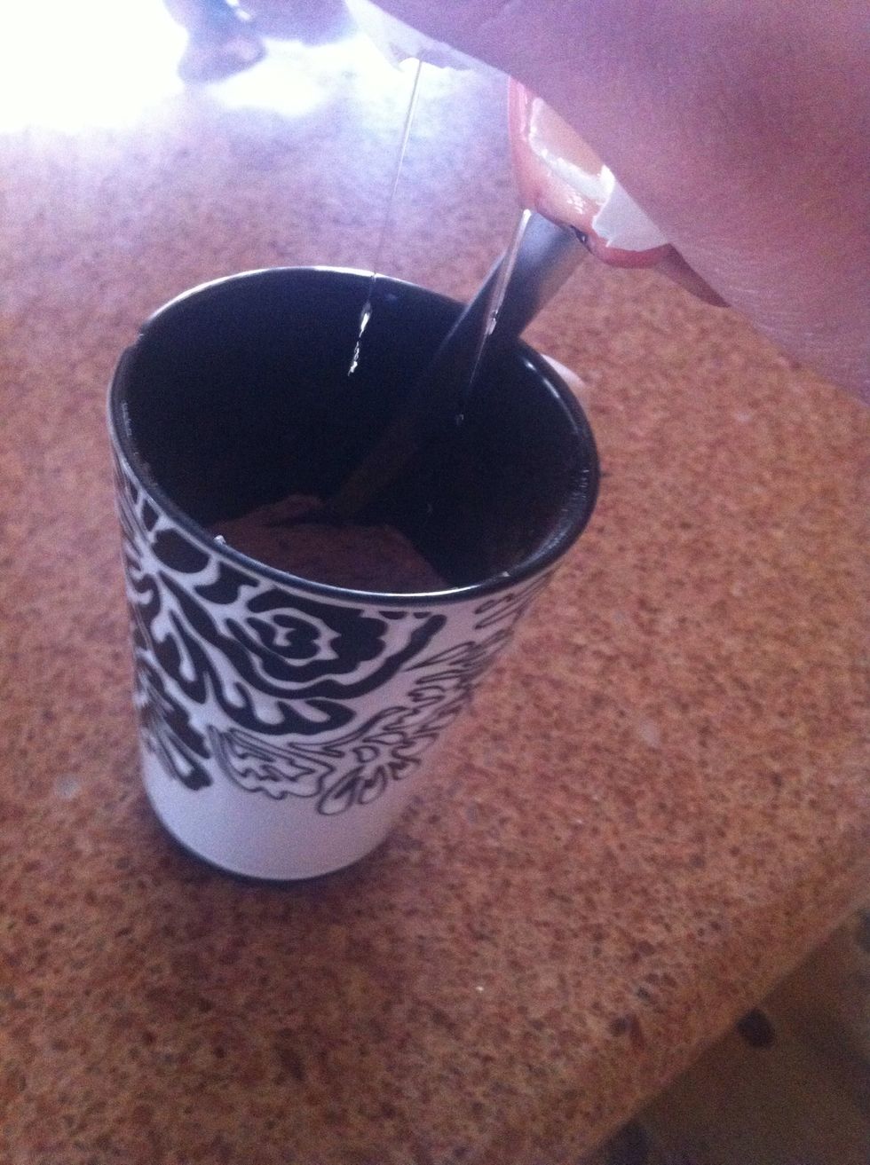 Stir your dry ingredients together. Then crack an egg into the mug