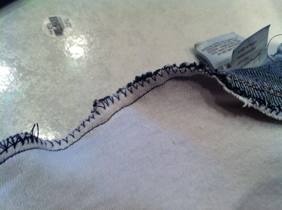 Stitch a straight line all the way around the waist about 1/4-5/8 inches from the edge, then go around the edge with a zig zag to prevent fraying.