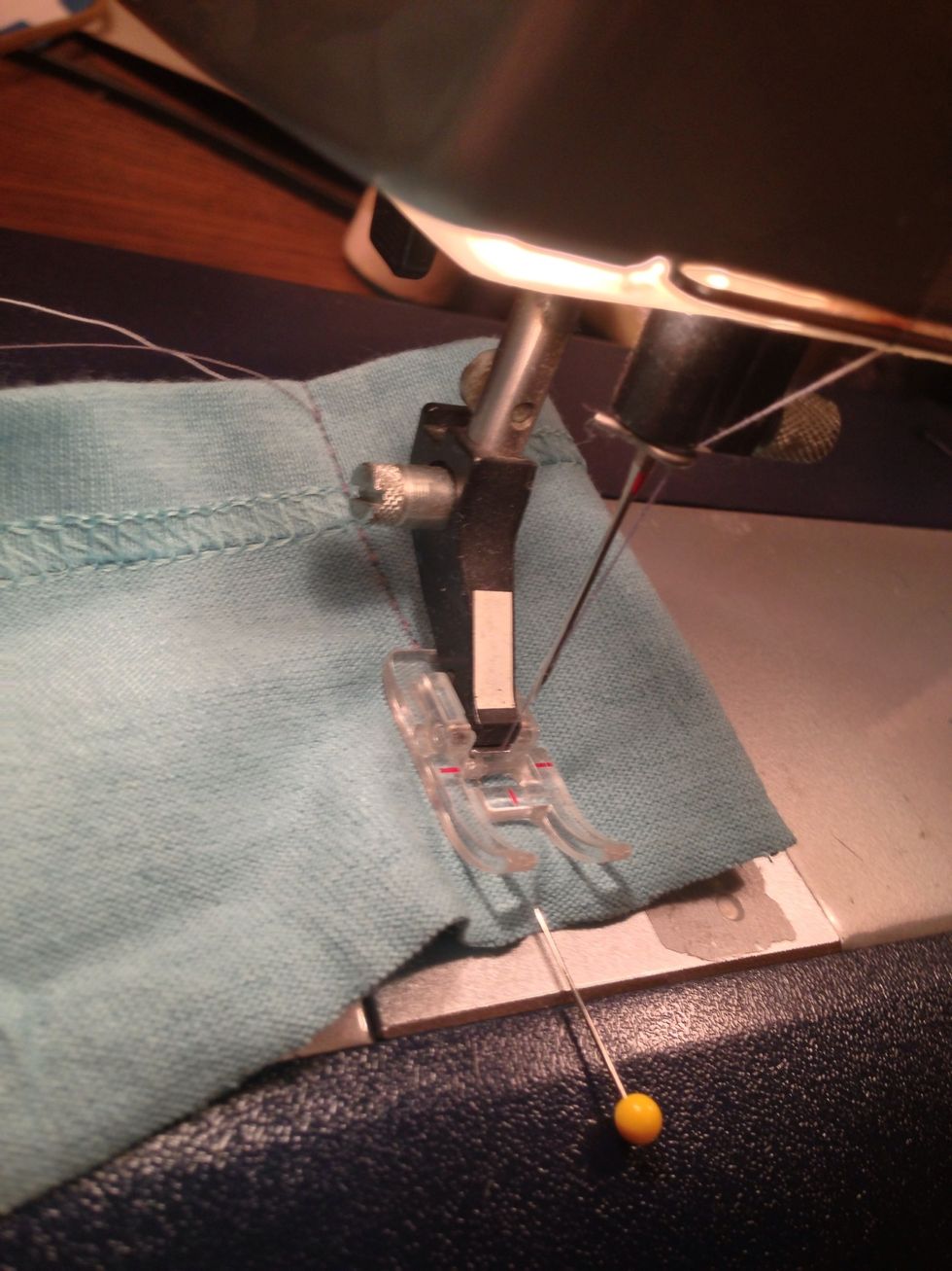 Stitch across the hem banding and trim excess.