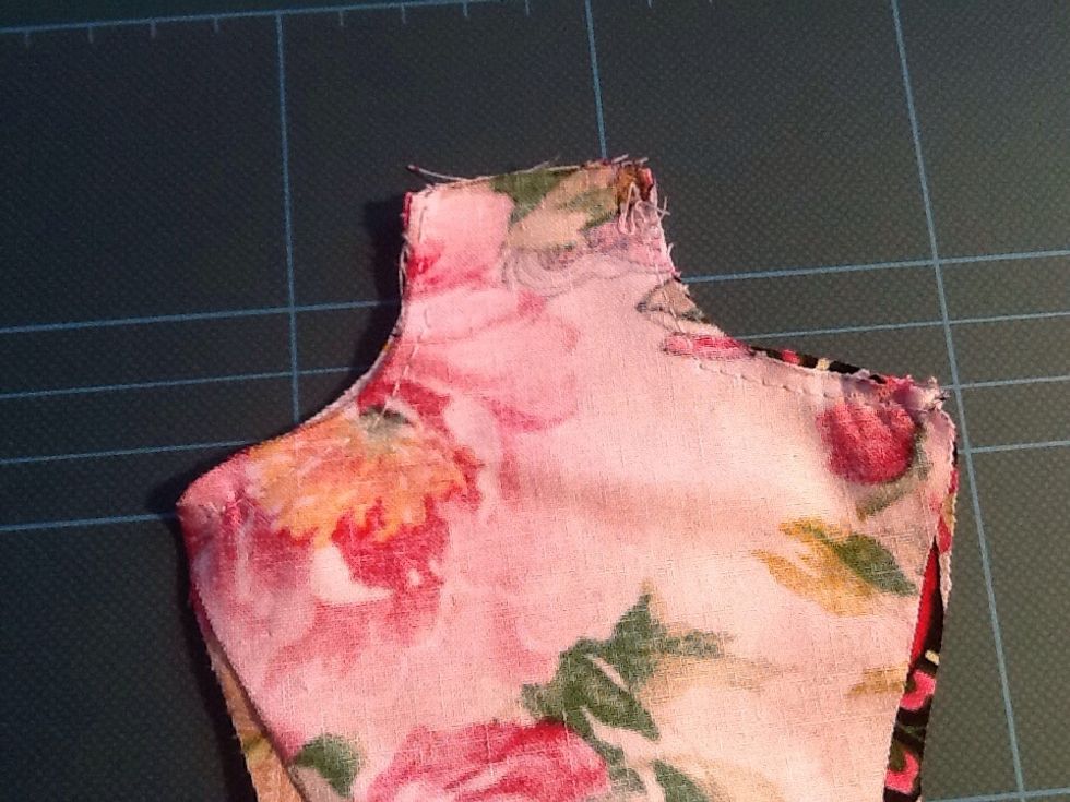 Stitch across the shoulders from the neck down, both sides, remembering to back stitch and cut off excess thread as you go along.