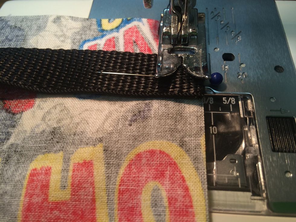 Stitch across the webbing to hold into place. REVERSE a few times so the strap is held strongly in place - you want this to be strong! repeat with second piece.