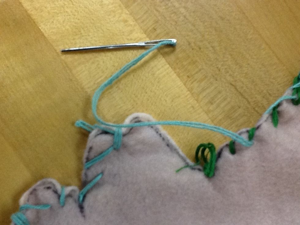 Stitch around border to attach front and back