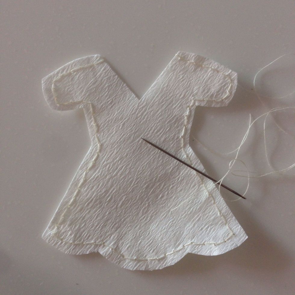 Stitch around the teabag leaving the top open... Alternatively, u can stitch them on a sewing machine; just be a little careful not to tear the teabag...