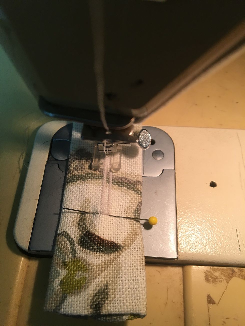 Stitch buttonholes in the middle of each tab to fit your covered buttons.