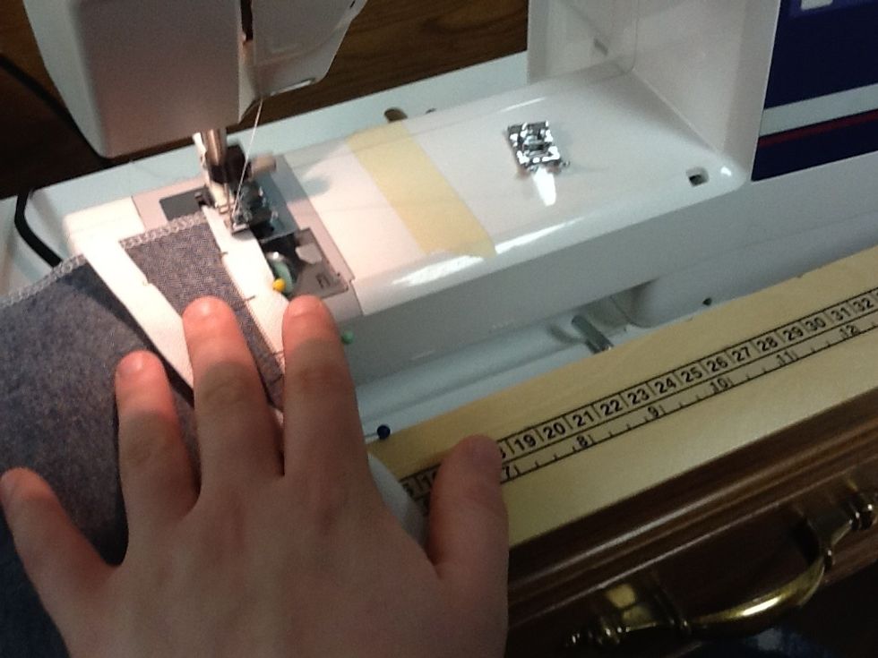 Stitch close to the zipper using the center of the presser foot as your guide.