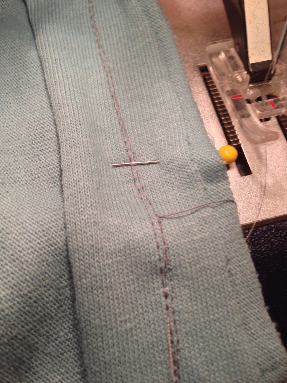 Stitch just to the left of the inch-strip stitching so you won't see those stitches from the right side.