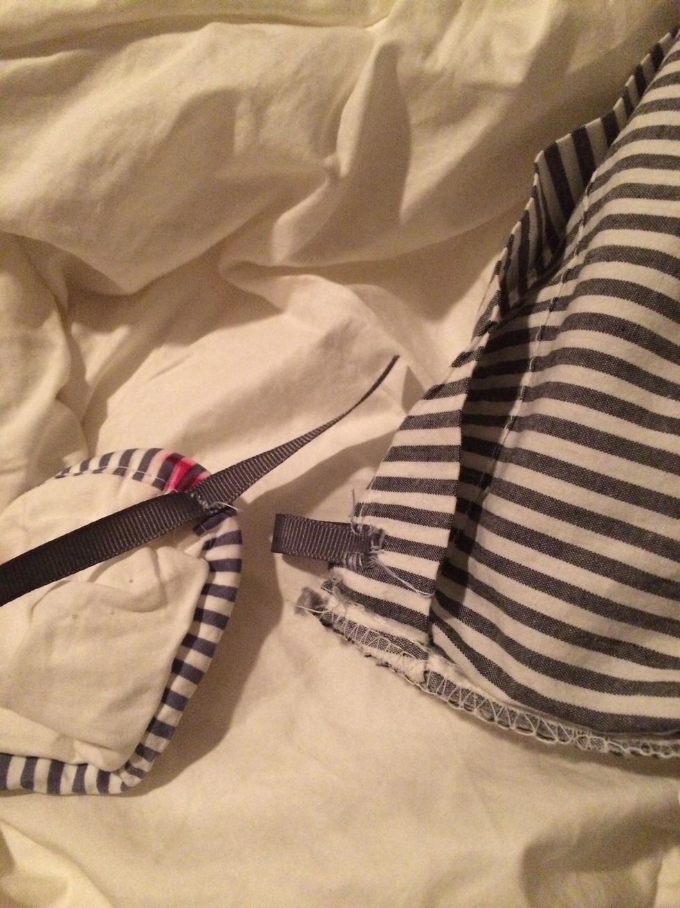 Stitch the center of the long piece to the duvet. Loop the short piece and stitch to the cover. (Or visa verse) this will connect the corners and keep the duvet in place inside the cover.